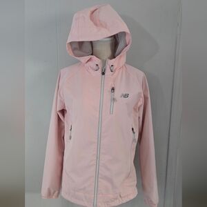 New Balance women's hooded windbreaker jacket in pink. 